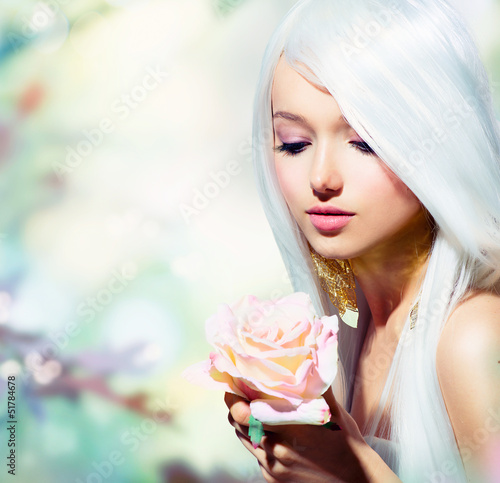 Photo: Beautiful Spring Girl With Rose Flower. Fantasy Beautiful Spring Girl With Rose Flower. Fantasy