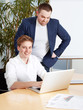 Two manager working on computer