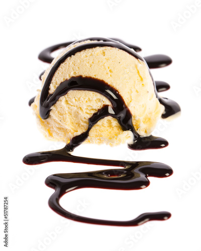 Photo: Vanilla icecream with chocolate sauce on white white background Vanilla icecream with chocolate sauce on white white background