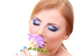 Beautiful young woman with glamour make up and flower, isolated