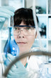 Photo: Tech with a measuring flask Tech with a measuring flask