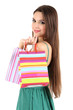 Young beautiful girl in green dress holding bright  shopping