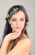 Young woman with beautiful hairstyle and wreath