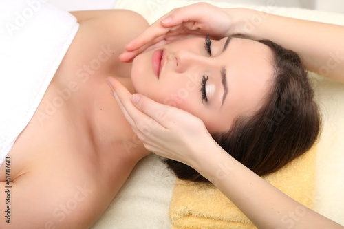 Photo: Beautiful young woman in cosmetic salon close up Beautiful young woman in cosmetic salon close up