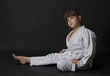 Preteen girl exercising karate