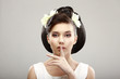 Hush! Woman showing Silence Sign with her Forefinger. Warning