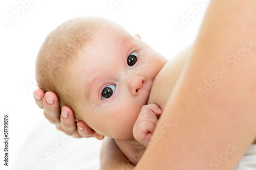 Photo: infant baby girl is suckling infant baby girl is suckling
