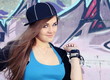 Playful Teenager Girl Posing near Wall