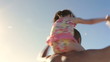 Father Carrying Daughter On Shoulders Spinning Around