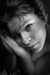 Black and white portrait of an praying girl.