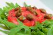 Salad with fresh tomatoes, capers and arugula