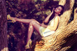 fashion. woman on tree