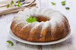 Vanilla and chocolate cake with mint laves  on wooden table