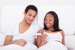Couple Holding Pregnancy Tester