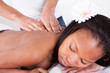 Woman Receiving Massage At Spa