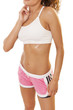 Fit woman checks her pulse after a workout.