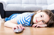 Cute little girl  watching tv on sofa