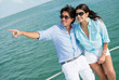 Couple pointing away in a yacht