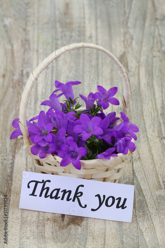 Photo: Thank you note and Campanula bell flowers in wicker basket Thank you note and Campanula bell flowers in wicker basket