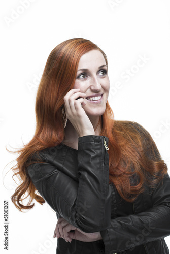 Photo: Attractive redhead chatting on her mobile Attractive redhead chatting on her mobile