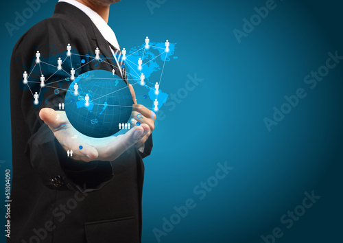 Photo: Holding a glowing earth globe social network in the hands Holding a glowing earth globe social network in the hands