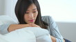 Chinese woman relaxing on couch