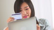 Chinese woman making a purchase on a tablet