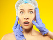 Photo: Plastic surgery. Isolated on yellow Plastic surgery. Isolated on yellow