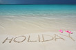 Photo: HOLIDAY writing on the sandy beach HOLIDAY writing on the sandy beach