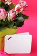 Photo: flowers roses in a vase on a pink background flowers roses in a vase on a pink background
