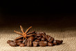 Coffee and Star Anise on sackcloth background with copyspace