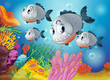 Four gray fishes under the sea
