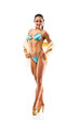 beautiful athletic girl wearing bikini posing over white