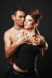 Foto: Couple in love. Happy loving couple. Dark background. Couple in love. Happy loving couple. Dark background.