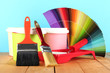 Paint pots, paintbrushes and coloured swatches