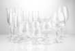 Cocktail and wine glasses, on gray background