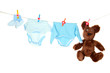 Baby clothes hanging on clothesline, isolated on white