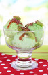 Delicious ice cream on table on bright background