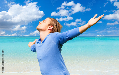 Photo: young man at the beach young man at the beach