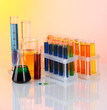 Colorful test tubes on light background