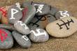 Fortune telling  with symbols on stones on burlap background
