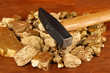 Golden nuggets with hummer on wooden background