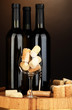 Wine and corks on barrel on brown background