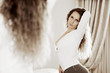 Woman looking in the mirror