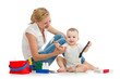 baby boy and mother playing together with construction set toy