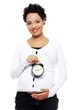 Photo: Pregnant woman with alarm clock Pregnant woman with alarm clock