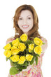Happy woman with yellow roses