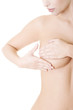 Caucasian adult woman examining her breast