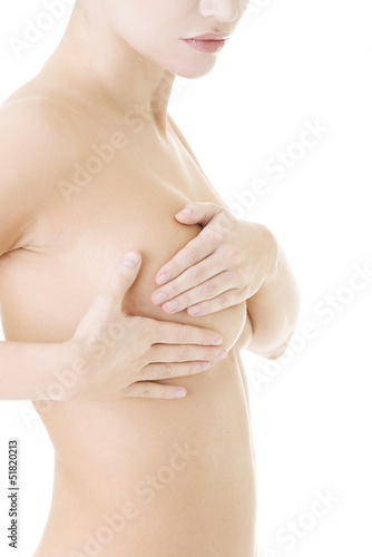 Photo: Caucasian adult woman examining her breast Caucasian adult woman examining her breast
