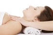 Photo: Attractive woman relaxing beeing massaged Attractive woman relaxing beeing massaged